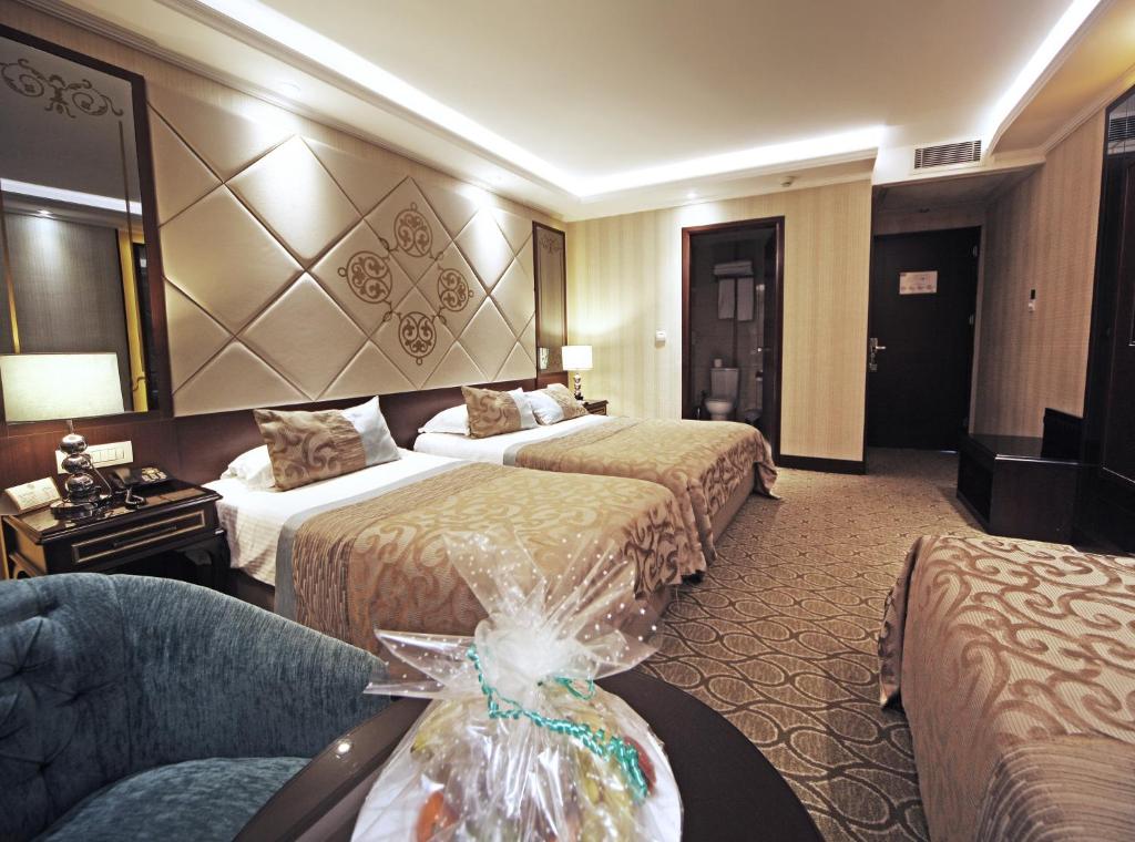 Un ou plusieurs lits dans un hébergement de l'établissement The Parma Hotel Downtown