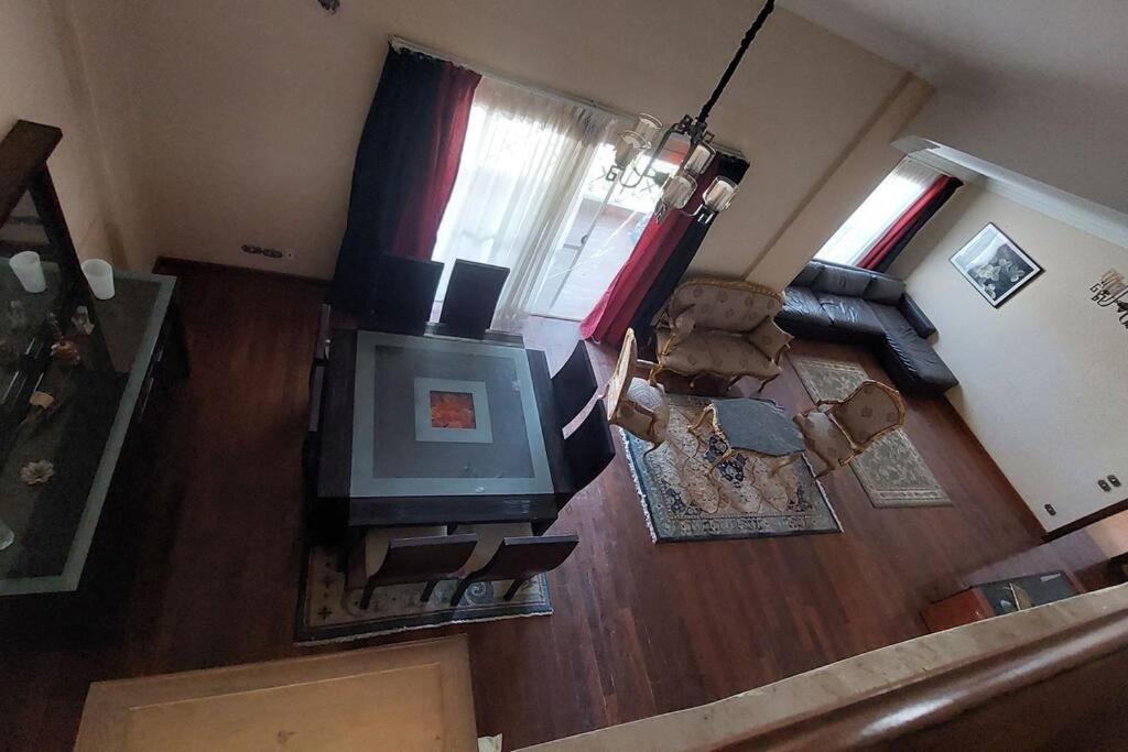 an overhead view of a living room with a television at Spacious cheerful apartment in Cairo