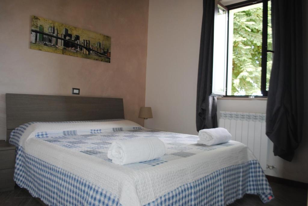 Postel nebo postele na pokoji v ubytování Agriturismo B&B La Cerasa