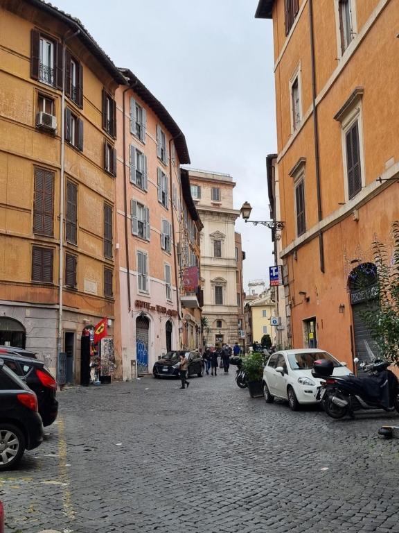 a cobblestone street in a city with buildings at Paradise Penthouse Suite Amazing View in Rome