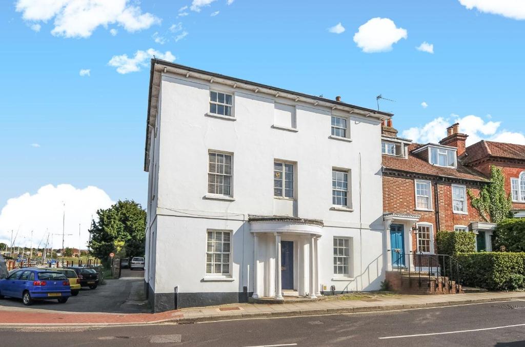 a white house on the side of a street at Dolphin House, Emsworth in Emsworth