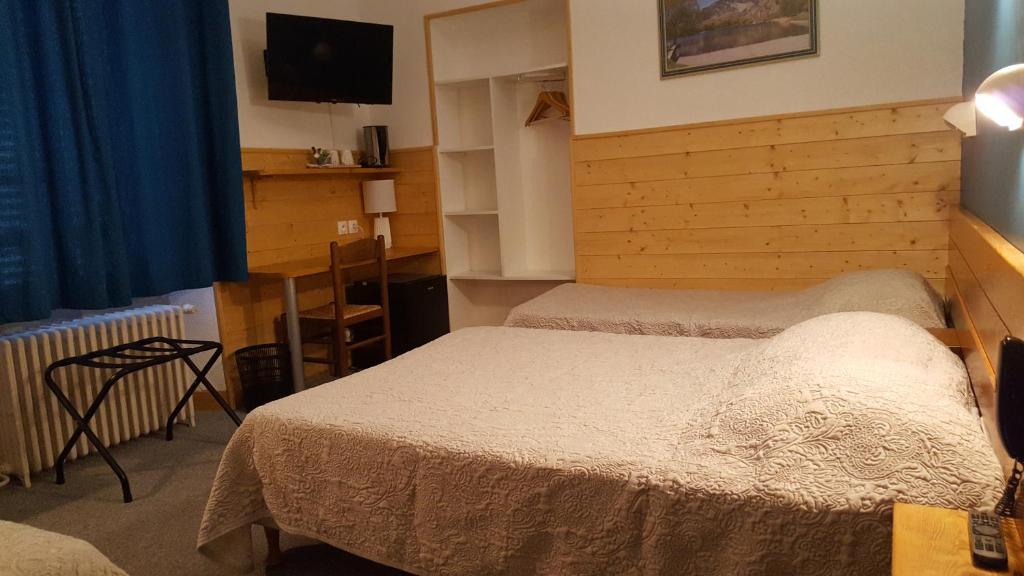 Postel nebo postele na pokoji v ubytování Hôtel Restaurant Glaizette