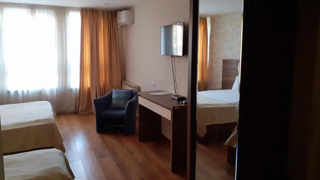 Postel nebo postele na pokoji v ubytování Hotel Lile
