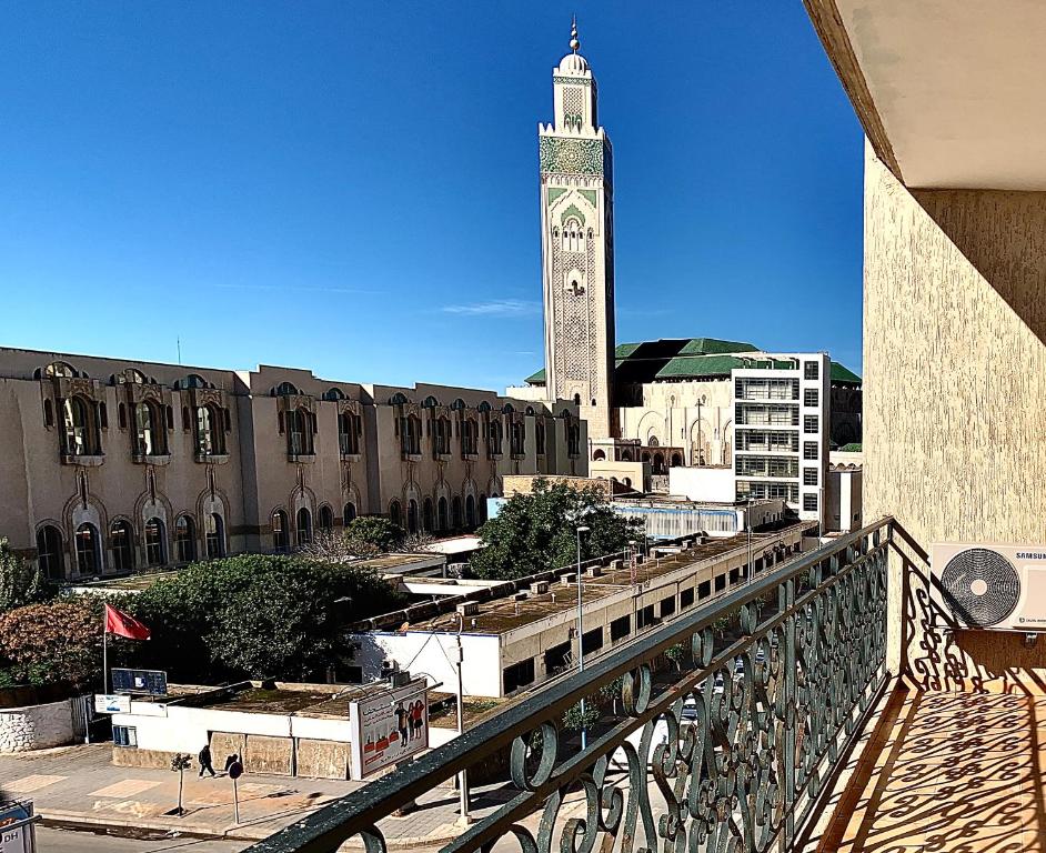 a view of a clock tower in a city at Sab 12 - Amazing View of the Mosque Hassan. Luxury apartment. 2 Bedrooms. in Casablanca