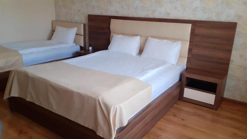Postel nebo postele na pokoji v ubytování Hotel Lile