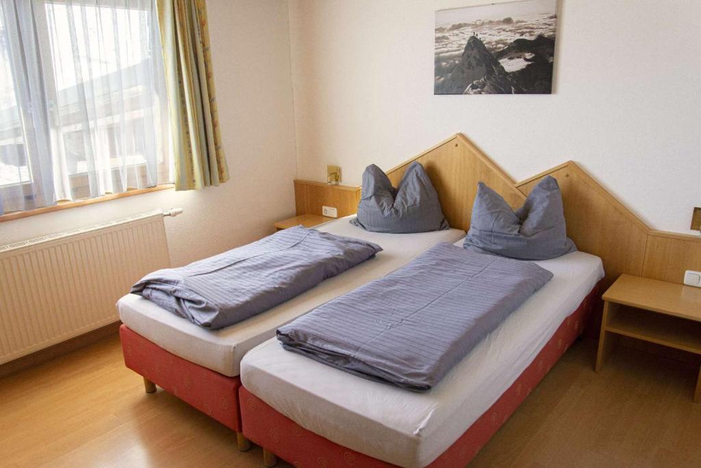 Postel nebo postele na pokoji v ubytování Wallackhaus RegioJet Hotels