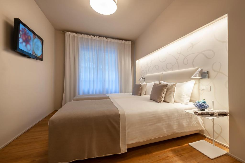 Postel nebo postele na pokoji v ubytování Hotel Monte Meraviglia
