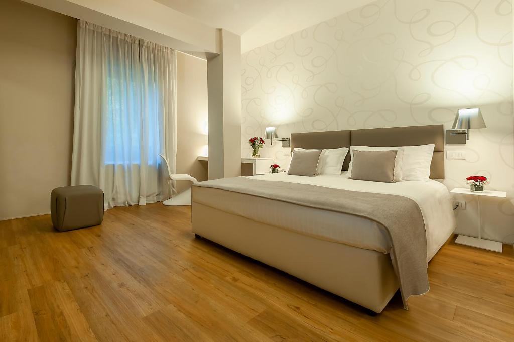 Postel nebo postele na pokoji v ubytování Hotel Monte Meraviglia