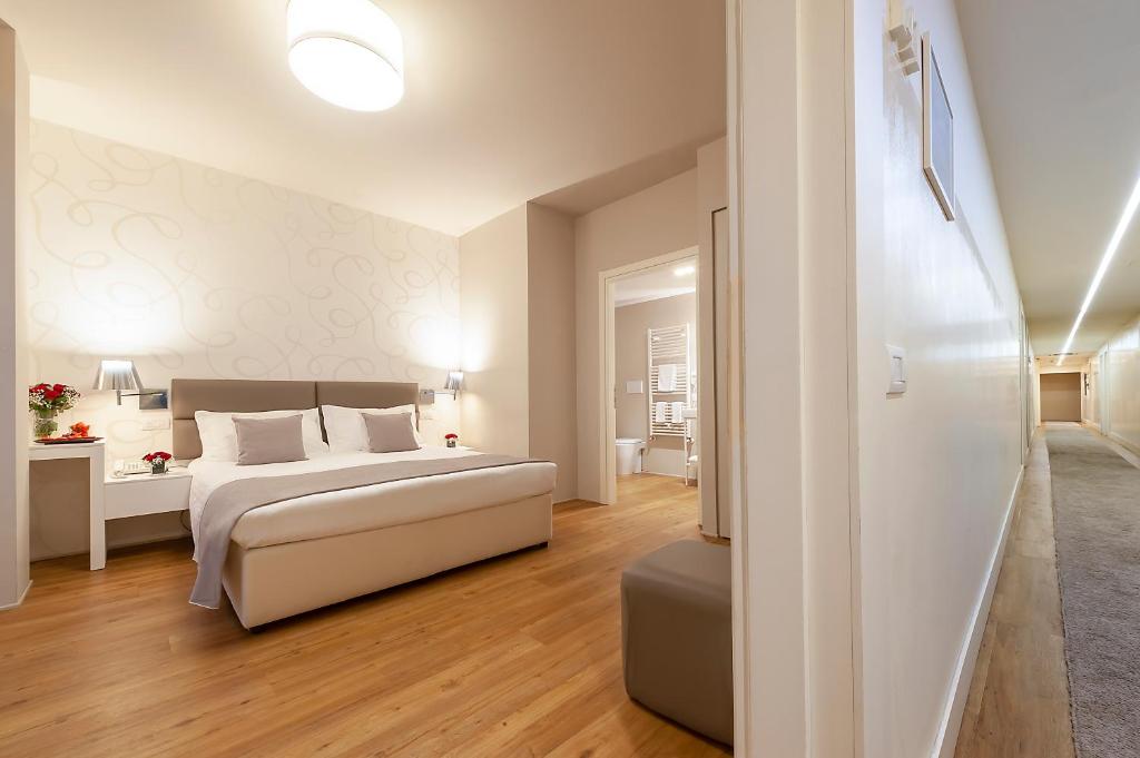 Postel nebo postele na pokoji v ubytování Hotel Monte Meraviglia