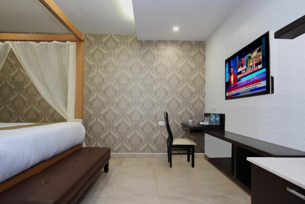 TV a/nebo společenská místnost v ubytování Ambaari hotel