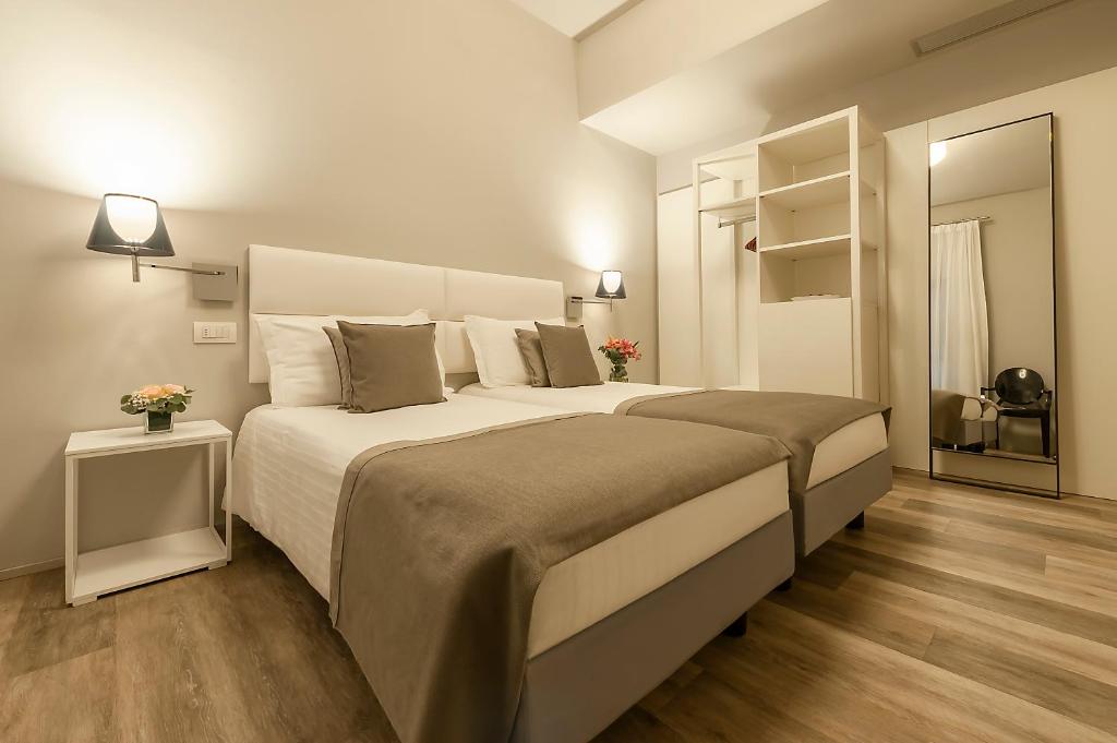 Postel nebo postele na pokoji v ubytování Hotel Monte Meraviglia