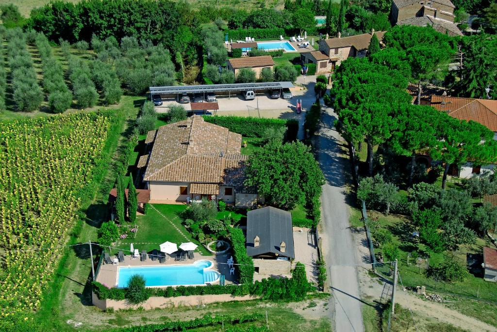 an aerial view of a house with a train at Agriturismo La Dolce Collina in Paciano