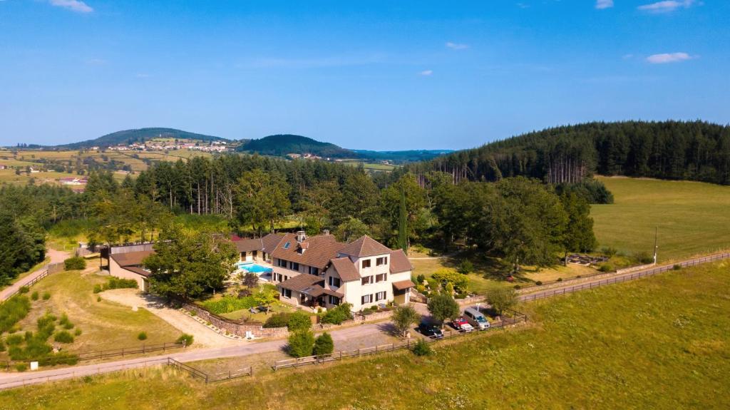 an aerial view of a large house in a field at Domaine Sur-Valot in Beaubery