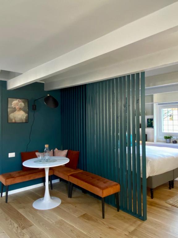 a bedroom with a table and a bed and a table and chairs at Paradise Penthouse Suite Amazing View in Rome