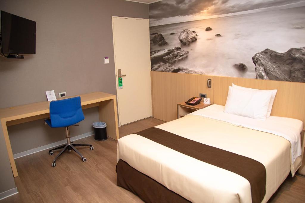 Postel nebo postele na pokoji v ubytování Palmetto Hotel Business San Borja