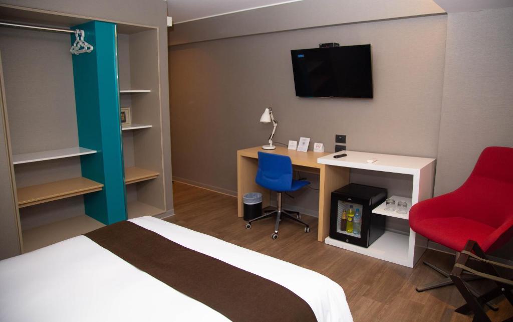Postel nebo postele na pokoji v ubytování Palmetto Hotel Business San Borja