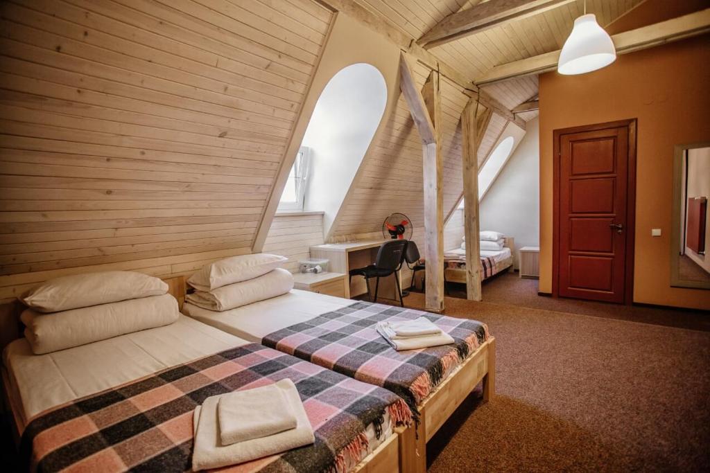 Postel nebo postele na pokoji v ubytování Guest House "Arkhistratyg"