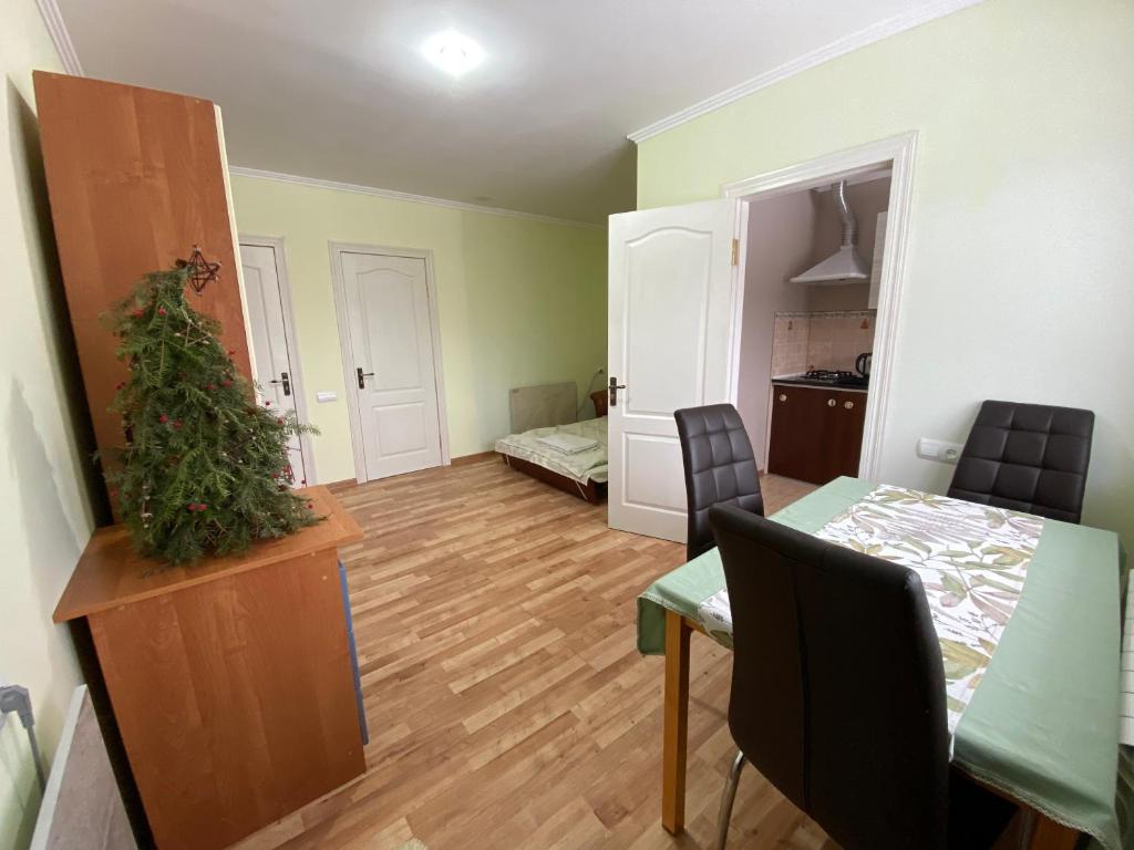 a living room with a table and a dining room at ZWIN Apartment 2 in Skole