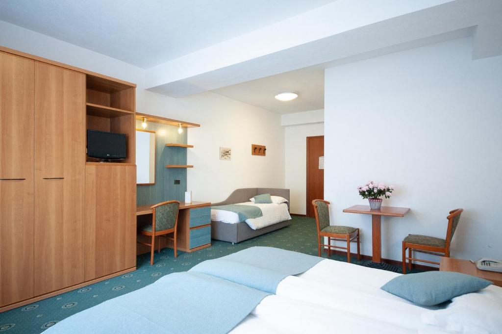 Postel nebo postele na pokoji v ubytování Albergo San Carlo