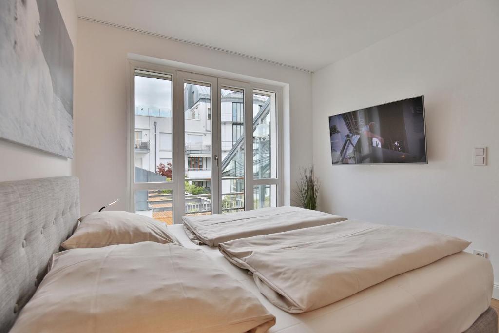 Postel nebo postele na pokoji v ubytování Seaside Seaside Appartement 18