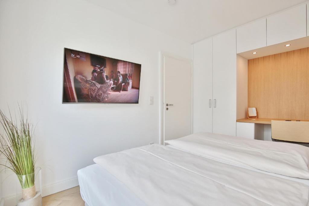 Postel nebo postele na pokoji v ubytování Seaside Seaside Appartement 18