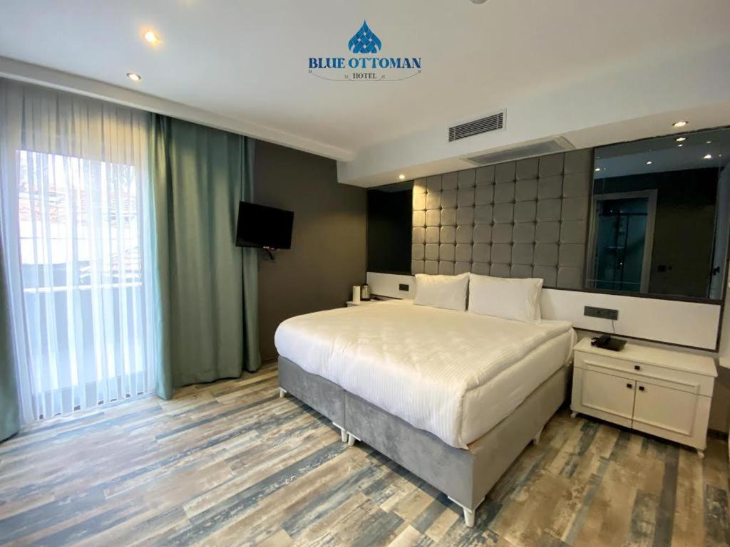 A bed or beds in a room at Hotel Blue Ottoman