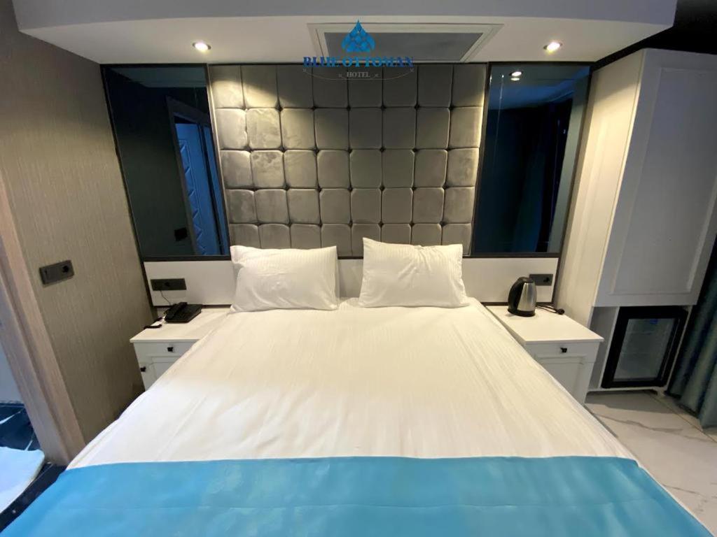 A bed or beds in a room at Hotel Blue Ottoman