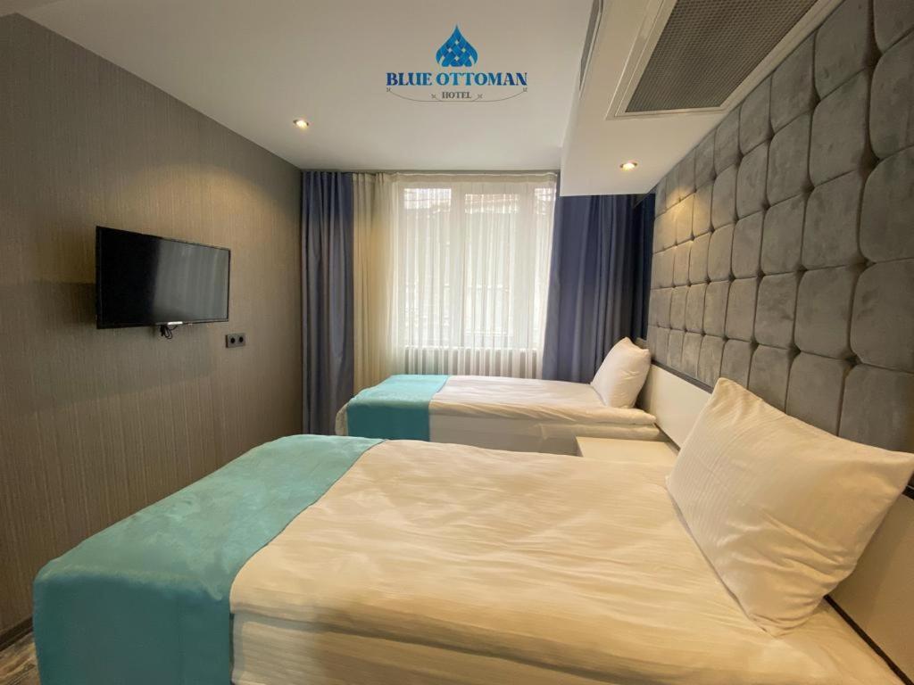 A bed or beds in a room at Hotel Blue Ottoman
