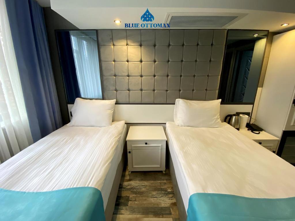 A bed or beds in a room at Hotel Blue Ottoman