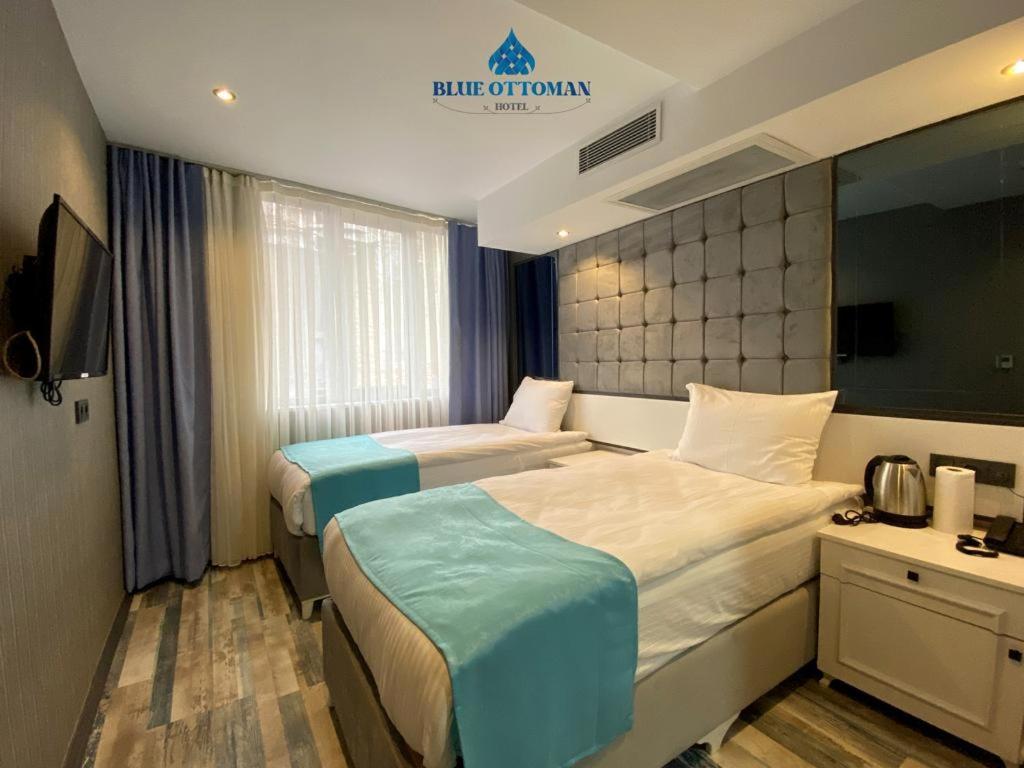 A bed or beds in a room at Hotel Blue Ottoman