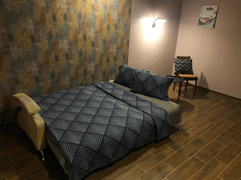 Кровать или кровати в номере Квартира в центре города
