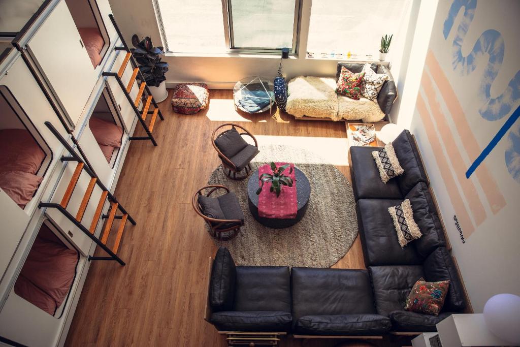 an overhead view of a living room with a couch and a table at STAY OPEN Venice Beach in Venice