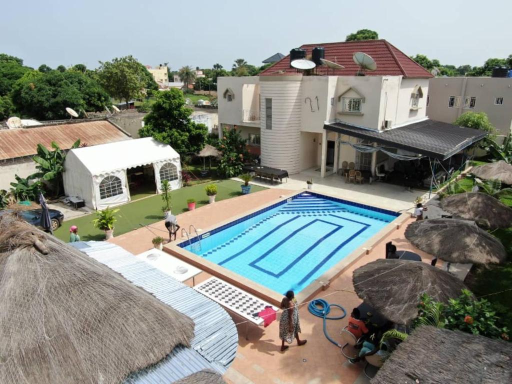 an aerial view of a house with a swimming pool at Residence 21 in Kololi