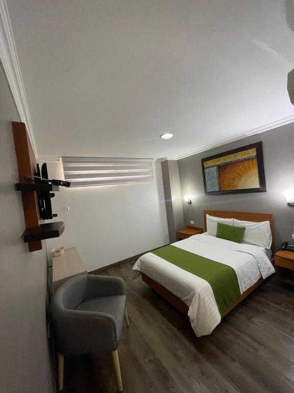 Postel nebo postele na pokoji v ubytování Hotel Plaza Monte Carlo
