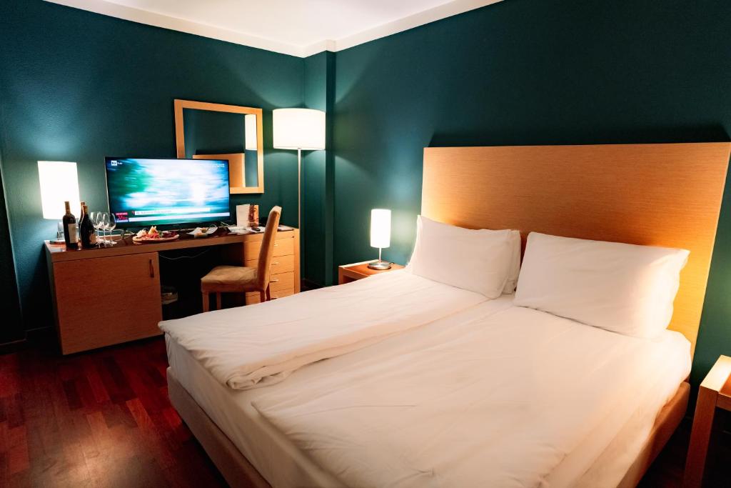Postel nebo postele na pokoji v ubytování Savoia Resort