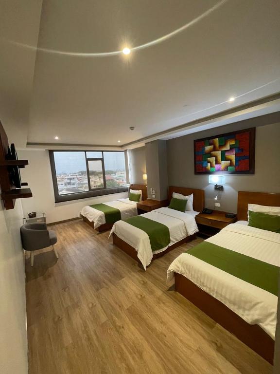 Postel nebo postele na pokoji v ubytování Hotel Plaza Monte Carlo