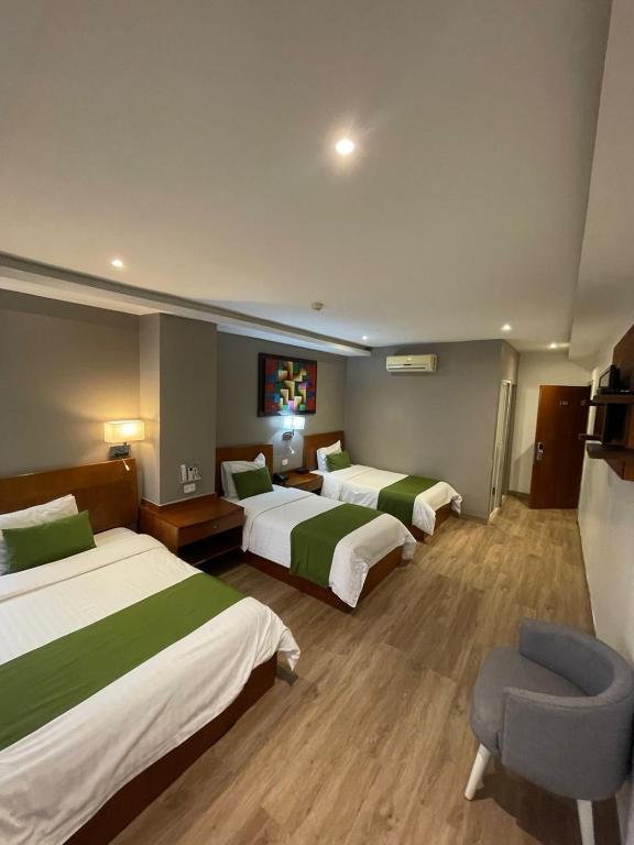 Postel nebo postele na pokoji v ubytování Hotel Plaza Monte Carlo