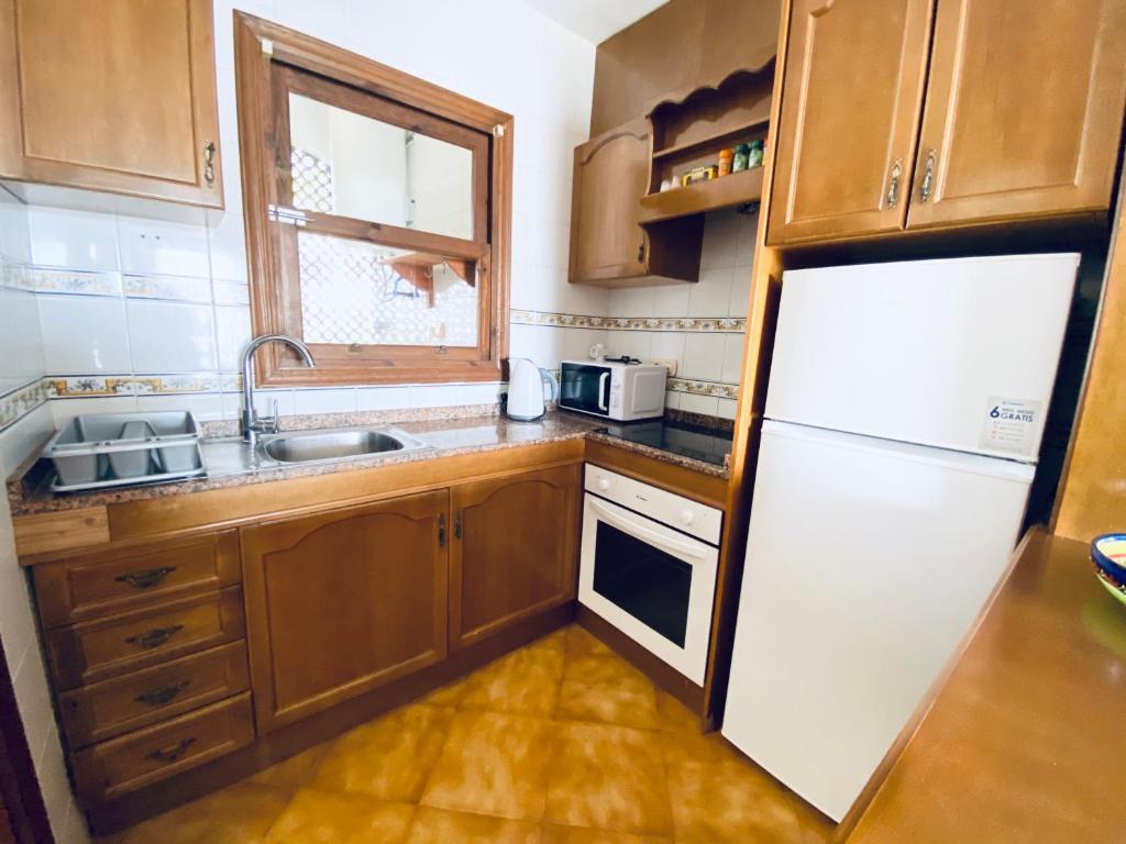 Kuchyň nebo kuchyňský kout v ubytování Apartamento Bellavista IV