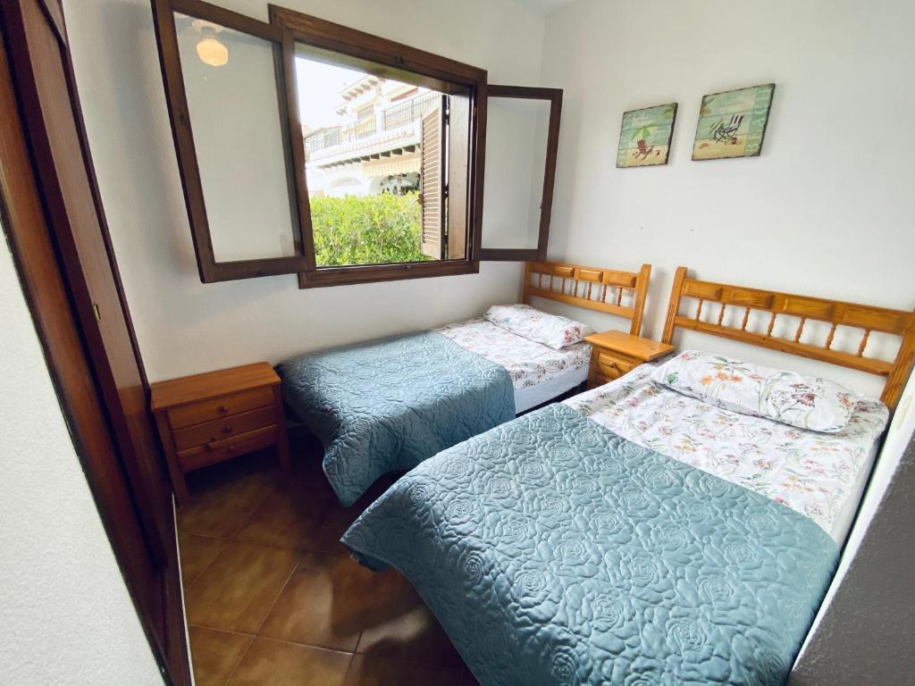 Postel nebo postele na pokoji v ubytování Apartamento Bellavista IV