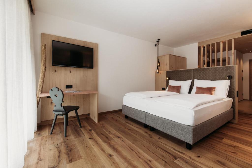 Postel nebo postele na pokoji v ubytování Weingut & Genusshotel Spitalerhof Superior