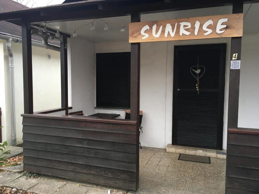 a sun rise restaurant with a sign on the door at Sunrise in Terme Catez in Čatež ob Savi
