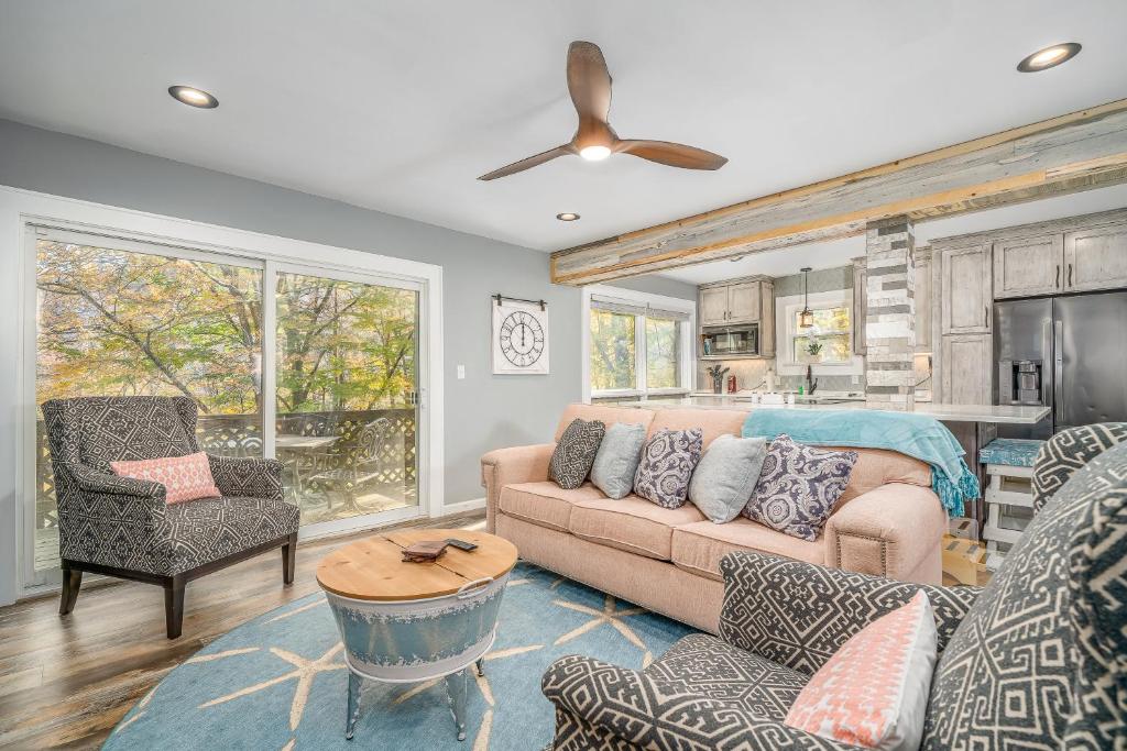 a living room with a couch and a table at Bee Branch 05 in Sugar Mountain
