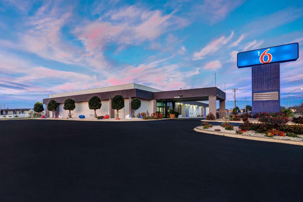 a gas station with a sign in front of it at Motel 6 Burlington in Burlington