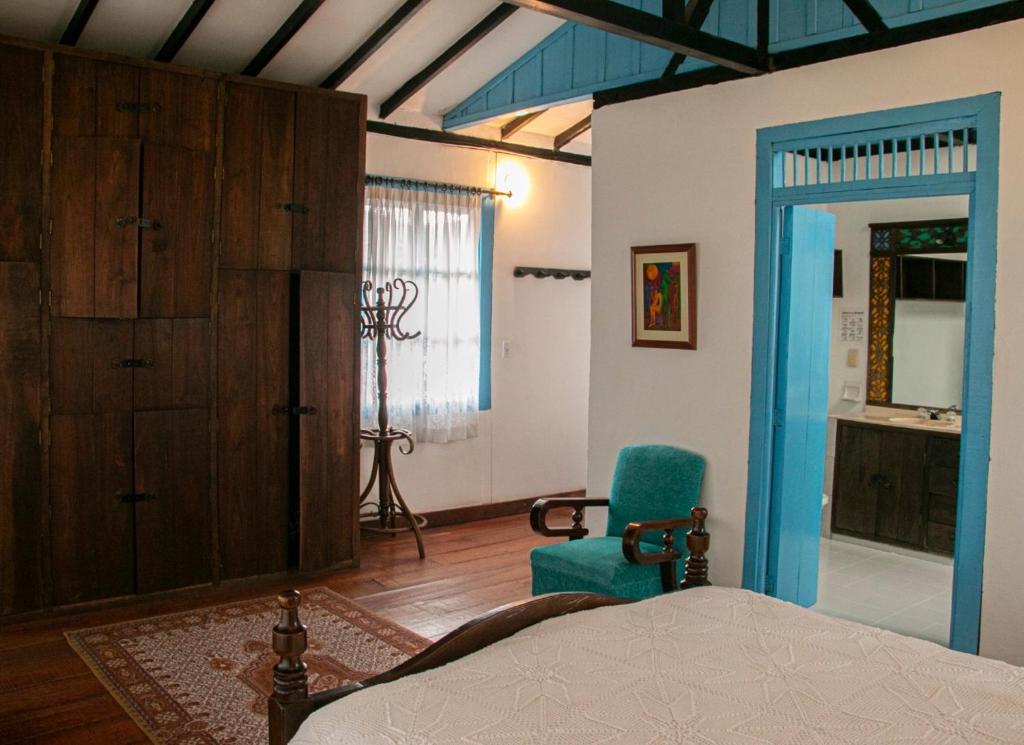 Llit o llits en una habitació de Casa Hotel El Compadre