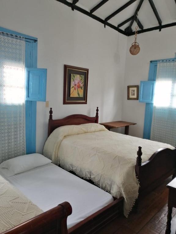 Llit o llits en una habitació de Casa Hotel El Compadre
