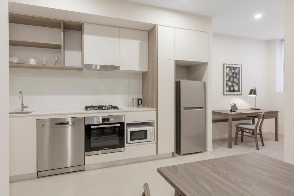 Kuchyň nebo kuchyňský kout v ubytování Brady Apartment Hotel Hardware Lane