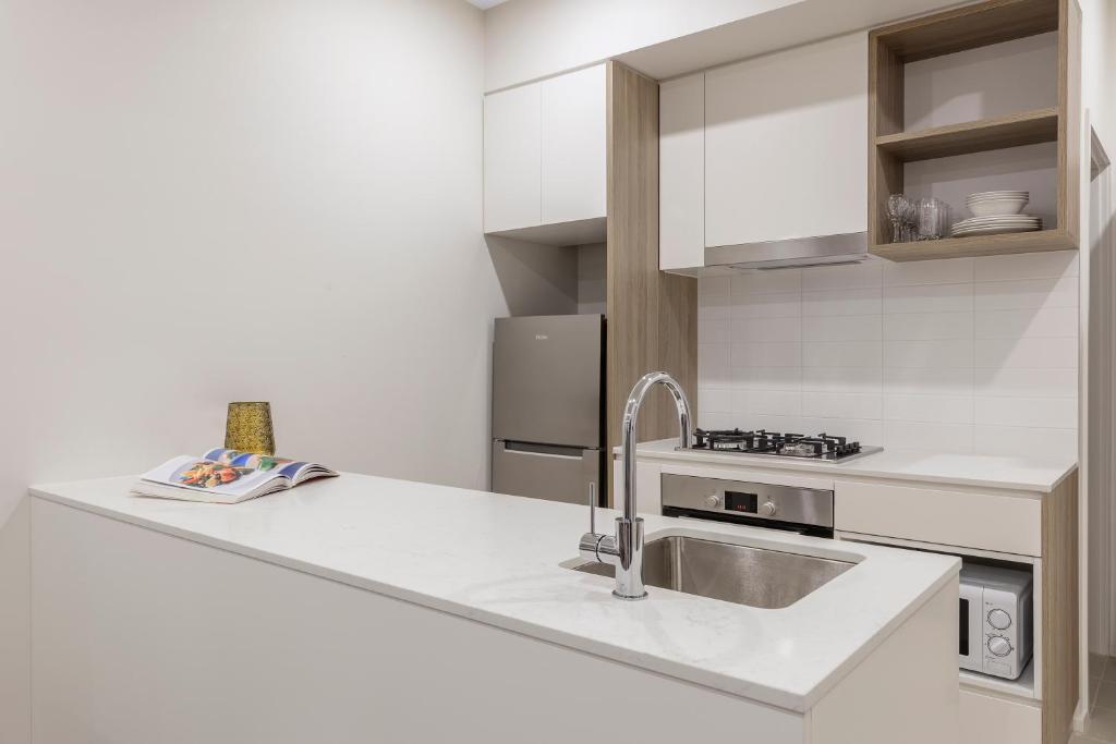 Kuchyň nebo kuchyňský kout v ubytování Brady Apartment Hotel Hardware Lane