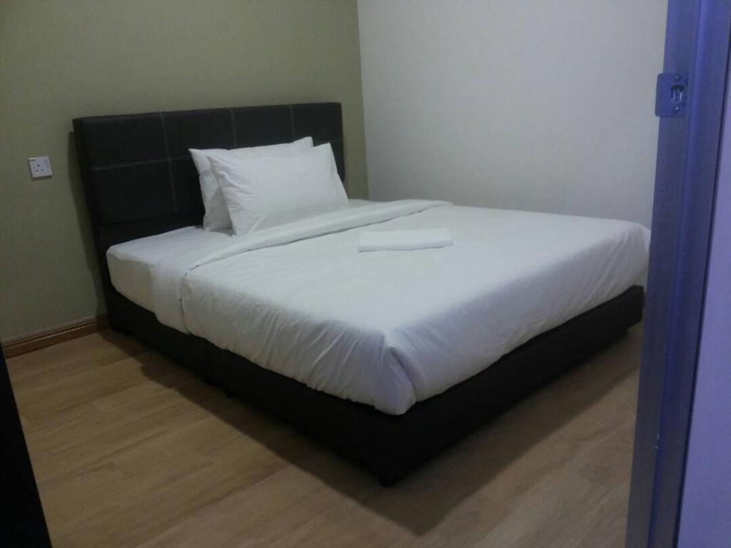 Postel nebo postele na pokoji v ubytování Gem Hotel Nusa Sentral Nusajaya