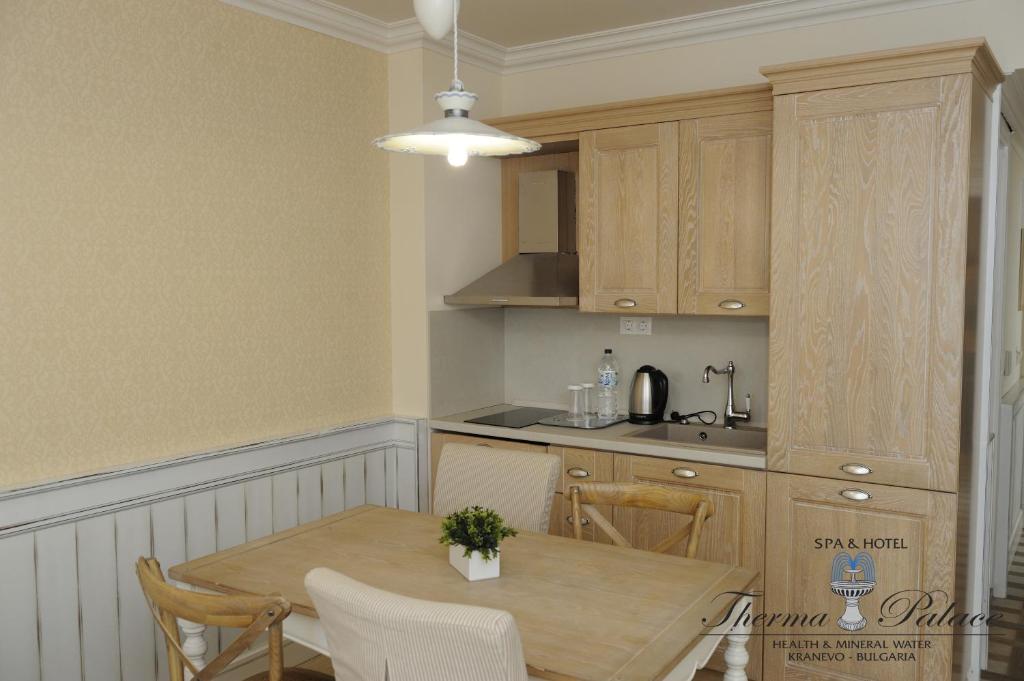 A kitchen or kitchenette at Therma Palace - All inclusive & Private Beach & Free Parking