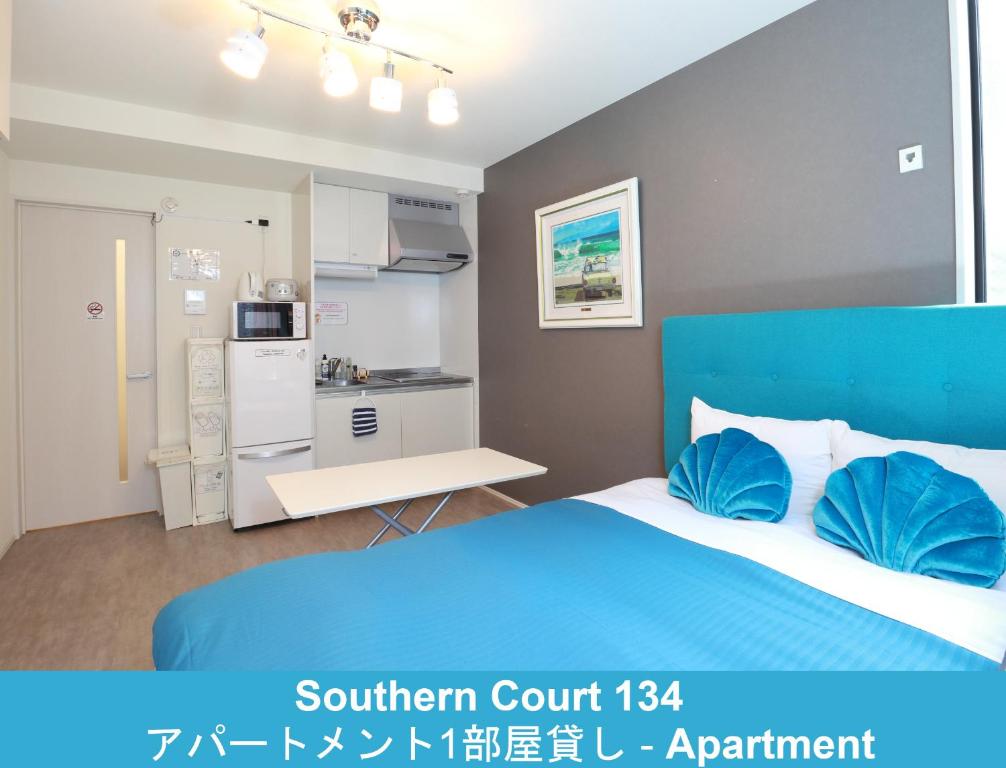 Postel nebo postele na pokoji v ubytování Enoshima Guest House 134